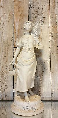 Art Nouveau grand sujet en biscuit figurant une femme au panier haut 60 cm