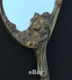 Miroir face à mains. Bronze art nouveau décor femme et fleurs