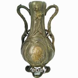 Vase sculpté art nouveau visages de femmes et fleurs en métal ou régule