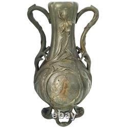 Vase sculpté art nouveau visages de femmes et fleurs en métal ou régule