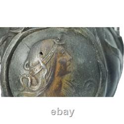 Vase sculpté art nouveau visages de femmes et fleurs en métal ou régule