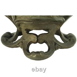 Vase sculpté art nouveau visages de femmes et fleurs en métal ou régule