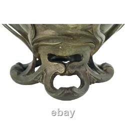 Vase sculpté art nouveau visages de femmes et fleurs en métal ou régule